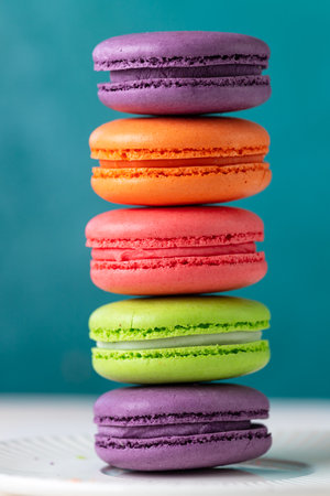 Colorful macaroni cookies with crumbsの写真素材