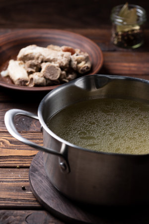 Boiled fatty broth in a saucepanの写真素材