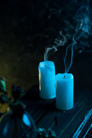 Extinguished candles on the tableの写真素材