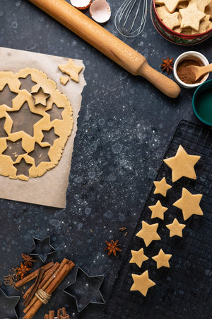 Cutting cookies in the shape of stars from the dough.
