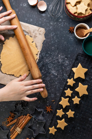 Cutting cookies in the shape of stars from the dough.の写真素材