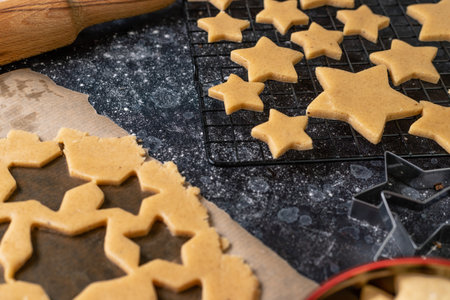 Cutting cookies in the shape of stars from the dough.の写真素材