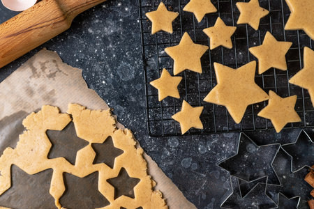 Cutting cookies in the shape of stars from the dough.の写真素材