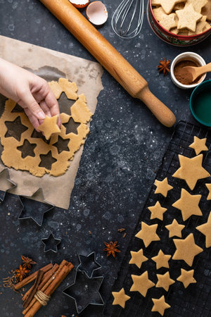 Cutting cookies in the shape of stars from the dough.の写真素材