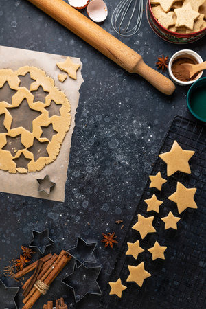 Cutting cookies in the shape of stars from the dough.の写真素材