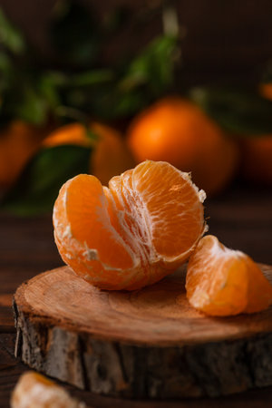 Tangerines in a plate on a wooden tableの写真素材