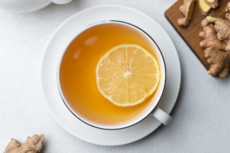 A cup of tea with lemon and ginger and mintの写真素材