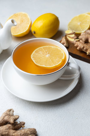 A cup of tea with lemon and ginger and mintの写真素材