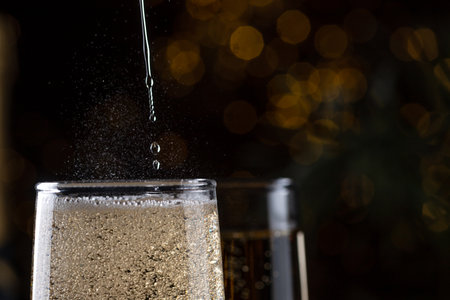 two glasses of champagne on the New Year's tableの写真素材