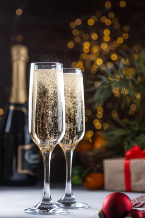 two glasses of champagne on the New Year's tableの写真素材