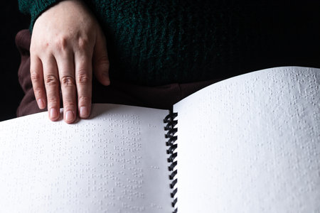 Reading a book in Brailleの写真素材