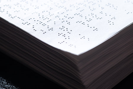 Reading a book in Brailleの写真素材