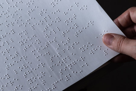 Reading a book in Brailleの写真素材
