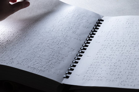 Reading a book in Brailleの写真素材