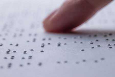 Reading a book in Brailleの写真素材