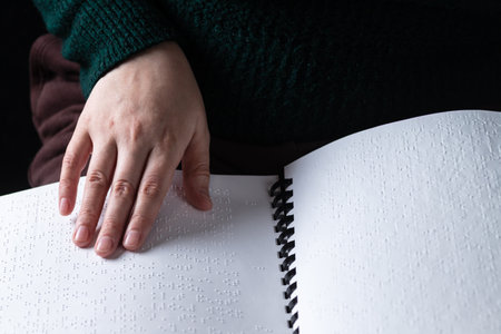 Reading a book in Brailleの写真素材