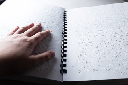 Reading a book in Brailleの写真素材