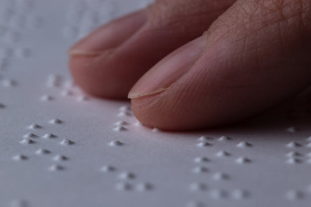 Reading a book in Brailleの写真素材