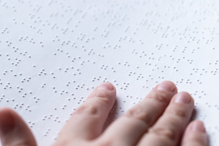 Reading a book in Brailleの写真素材