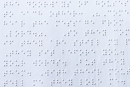 Reading a book in Brailleの写真素材