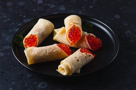 Pancakes with red caviar fillingの写真素材