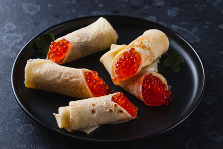 Pancakes with red caviar fillingの写真素材