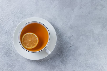 A mug of tea with a slice of lemonの写真素材
