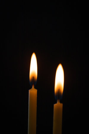 Burning candles on a black backgroundの写真素材