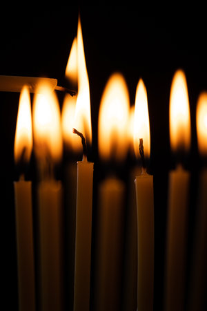 Burning candles on a black backgroundの写真素材