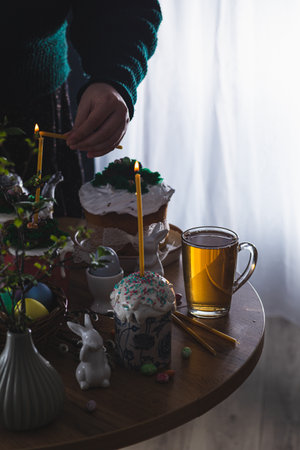 Easter cakes on the table with poured teaの写真素材