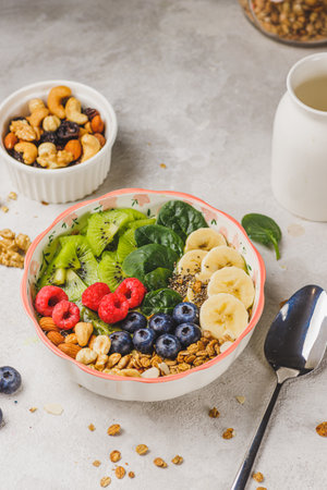 Smoothie bowl with granola and berriesの写真素材