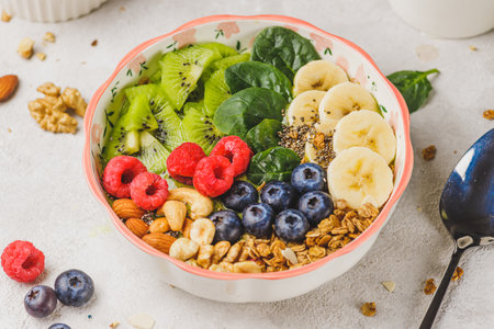Smoothie bowl with granola and berriesの写真素材