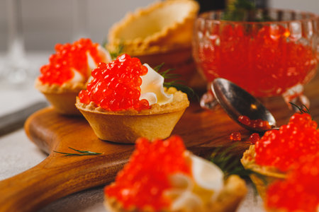 Tartlets with red caviar and cottage cheeseの写真素材
