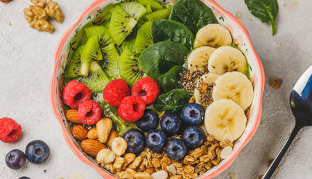Smoothie bowl with granola and berriesの写真素材
