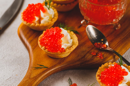Tartlets with red caviar and cottage cheeseの写真素材