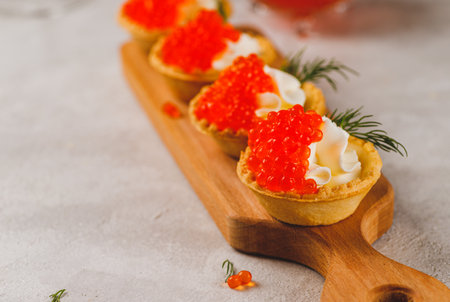 Tartlets with red caviar and cottage cheeseの写真素材