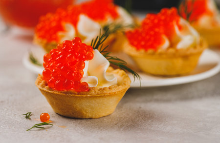 Tartlets with red caviar and cottage cheeseの写真素材