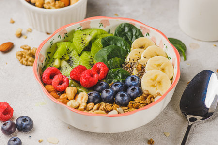 Smoothie bowl with granola and berriesの写真素材