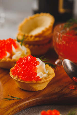 Tartlets with red caviar and cottage cheeseの写真素材