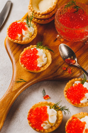 Tartlets with red caviar and cottage cheeseの写真素材