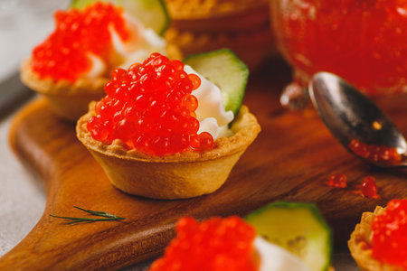 Tartlets with red caviar and cottage cheeseの写真素材