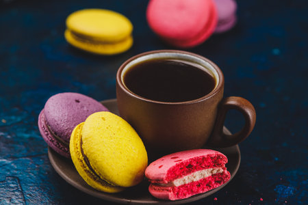 A cup of espresso coffee with macaron cookiesの写真素材