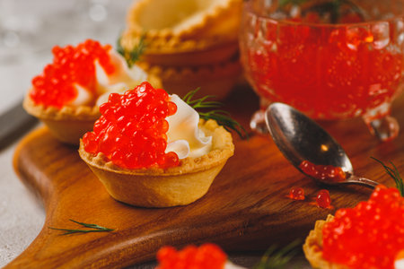 Tartlets with red caviar and cottage cheeseの写真素材