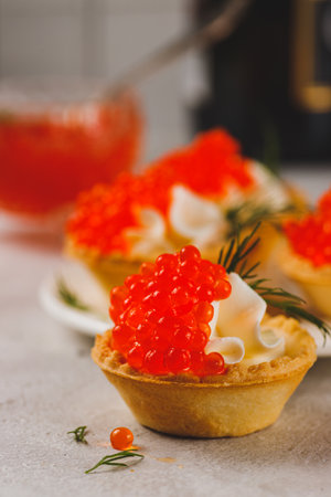 Tartlets with red caviar and cottage cheeseの写真素材
