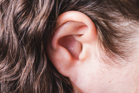 A small female ear is close