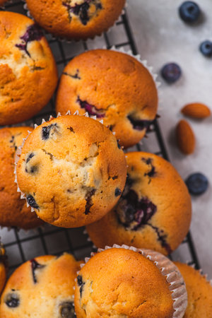 Blueberry muffins on the grill, next to blueberriesの写真素材