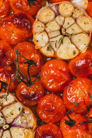 Cherry tomatoes baked with thyme and garlic cloveの写真素材