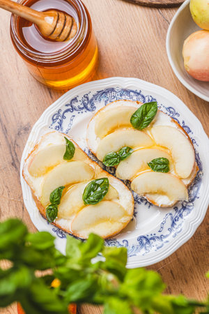 Bruschetta with ricotta and nectarines, garnished with honey and basilの写真素材