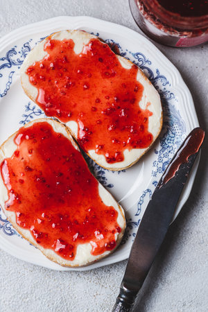 Sandwich with butter and raspberry jam