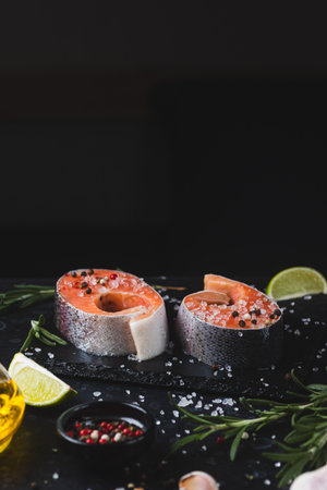 Raw trout steaks with seasoningsの写真素材